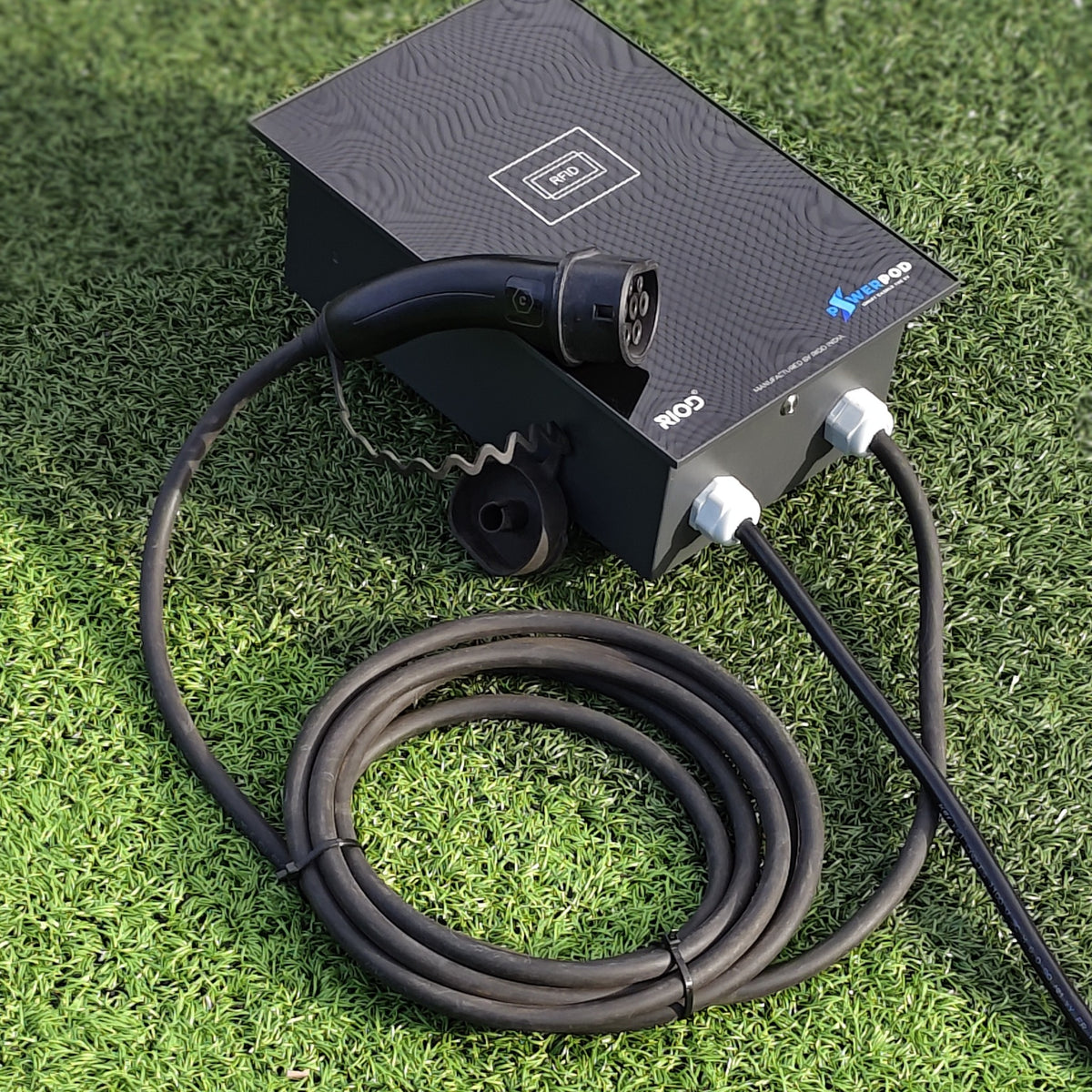 RIOD PowerPod AC EV charger with RFID panel, tethered Type 2 gun and 5 m coiled cable on grass
