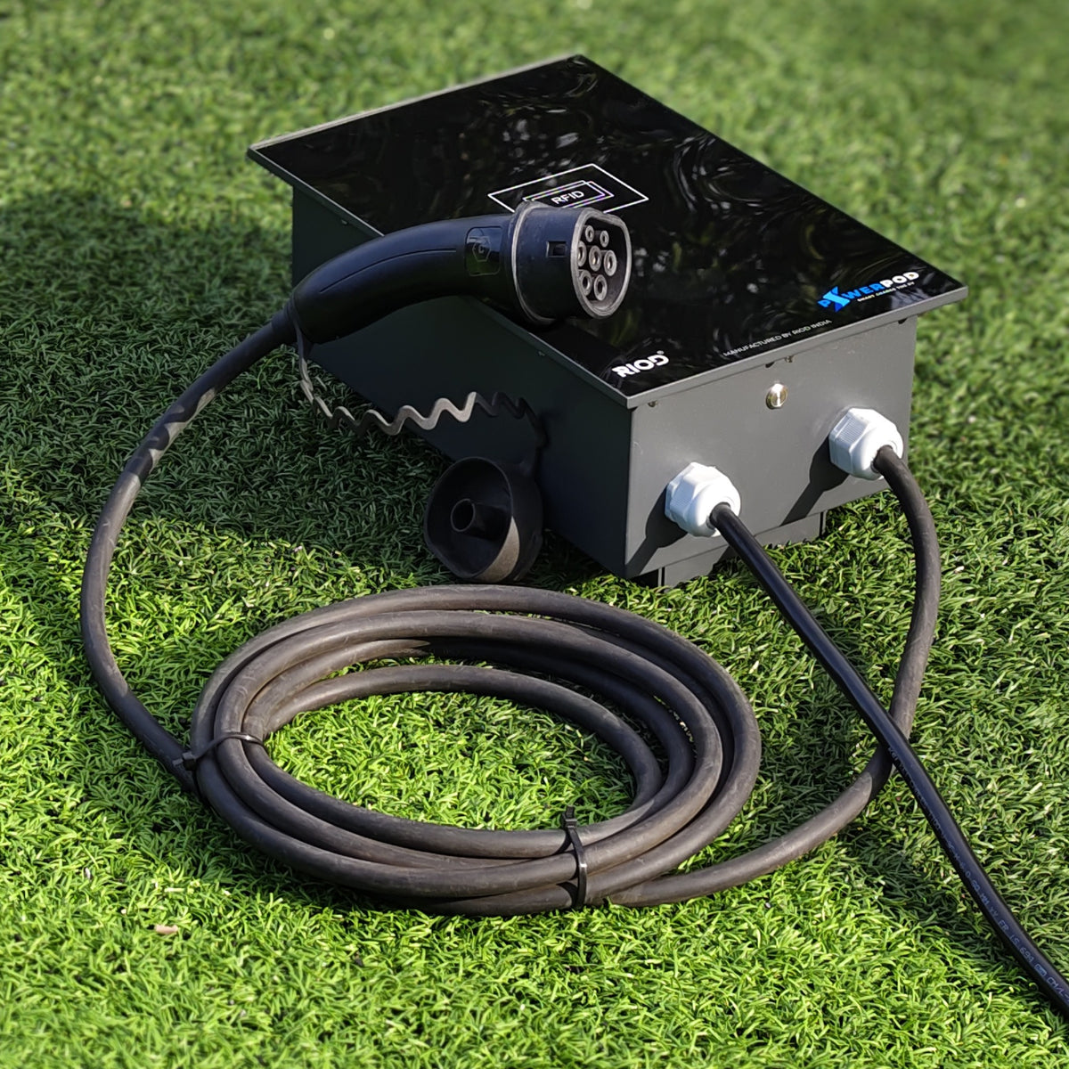 RIOD PowerPod AC EV charger, black enclosure with RFID panel, tethered Type 2 gun and coiled charging cable